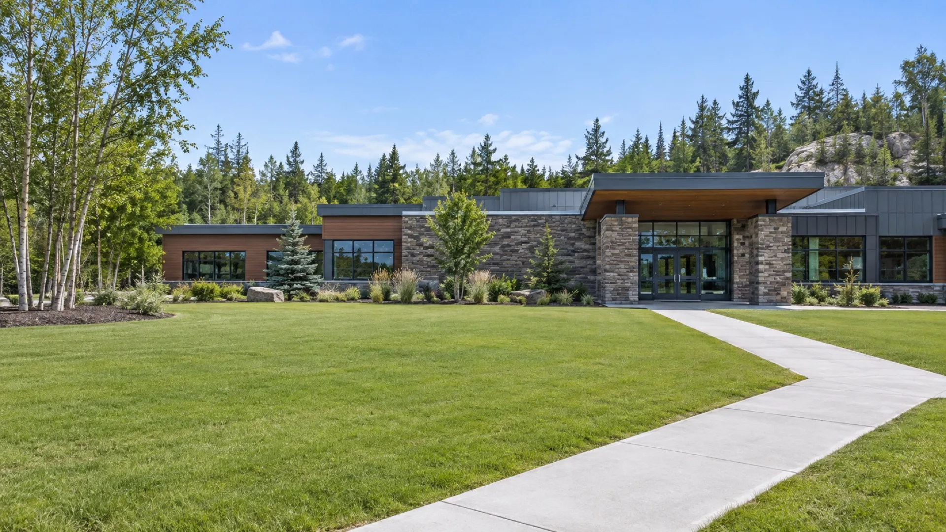 Kentucky Bluegrass lawn and walkway in front of a Northern Ontario community building.